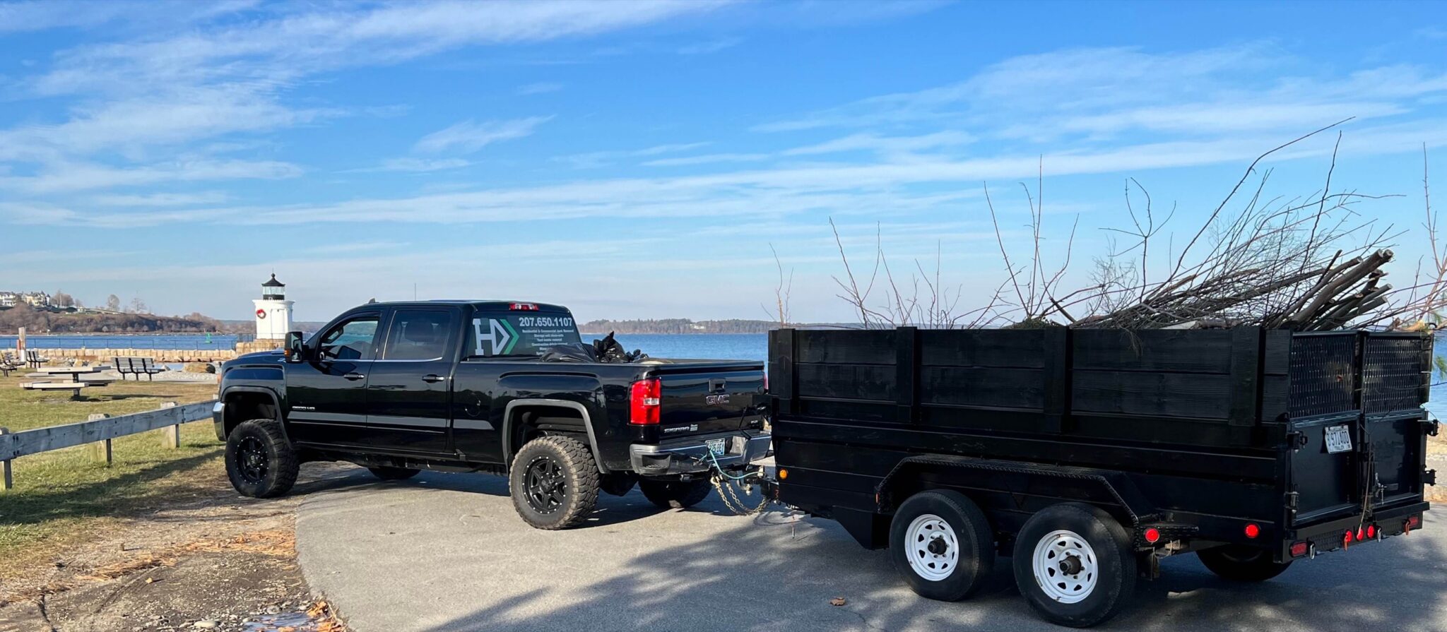 Haul Away Maine truck and trailer full of yard debris